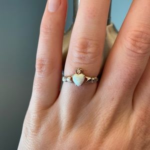 New ring two hands holding heart shaped pendant